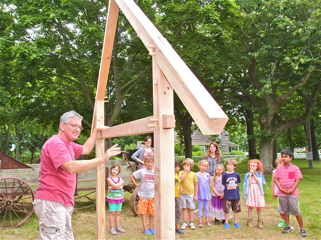 North Fork woodworker Tom Barry of Riverhead showed Arts on the Farm summer campers how a basic peg and beam structure.