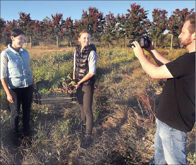 Photo by Paul Squire | Brent Sterling Nemetz (right) of Greenport is shooting the pilot for what he hopes will become a reality television series about Erin Fitzpatrick (left) and Lucy Muellner, owners of the Fork & Anchor general store in East Marion.