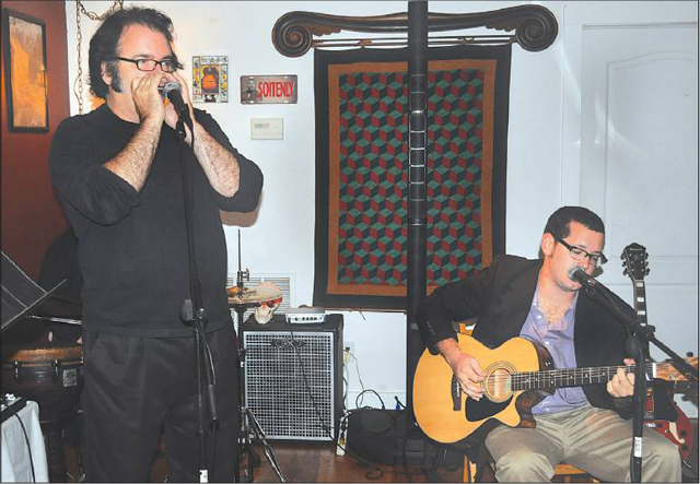 Photo by Cyndi Murray | Performers Chris Hurley (left) and Rob Europe are regulars at MEET’s open mic night.