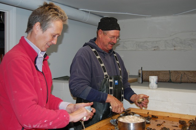 Photo by Charity Robey | Louise and Keith Clark opening scallops