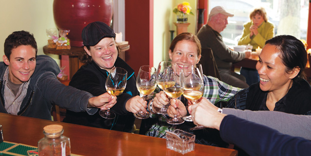 Photo by Katharine Schroeder | A group of friends from Manhattan share a toast at Biere on Main Street.