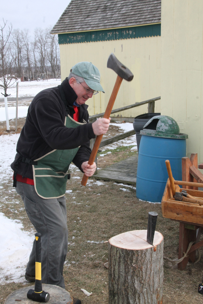 PAUL SQUIRE PHOTO | Tom Barry chops a log at Saturday afternoon's demonstration.