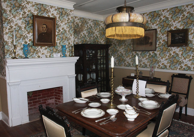 This formal dining room, built in 1852 by Ira Tuthill (shown in portrait), was part of a 10-room extension the Mattituck farmer made to his father's home.