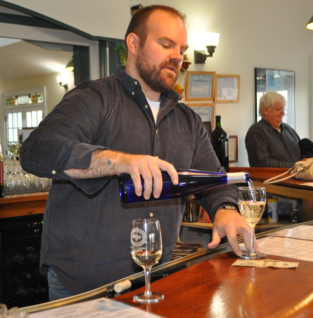 RACHEL YOUNG PHOTO | Derek Gerard pours a glass at a tasting in December.