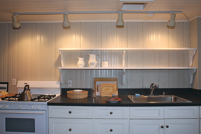 BARBARAELLEN KOCH PHOTO |The updated modern kitchen with beadboard paneling.