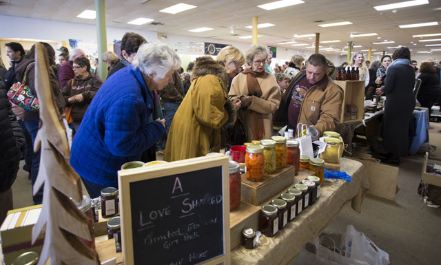 KATHARINE SCHROEDER PHOTO  |  A crowd of people check out what A Taste of the North Fork has to offer.