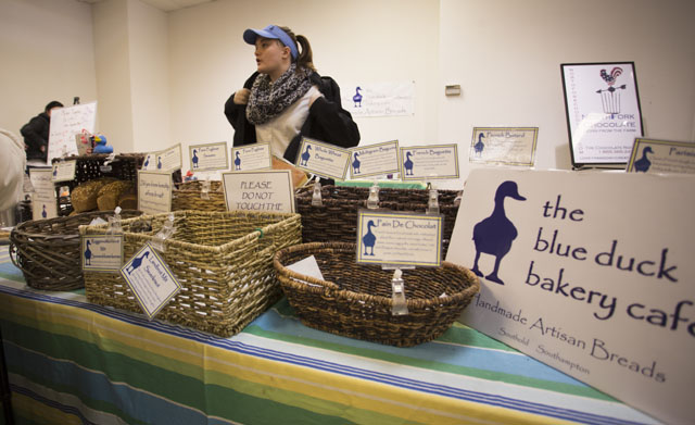 KATHARINE SCHROEDER PHOTO  |  Mary Faith Vetter from the Blue Duck Bakery lets customers know that more bread is on the way after selling out in record time.