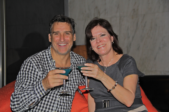 Dennis McDermott of tRP and Donna Chider of Hotel Indigo enjoy a glass of "Bottoms Up." (Carrie Miller Photo)