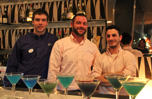 Bartender Zach Leffert of Bistro 72 at Hotel Indigo and bartenders Ian Pfister and Tom Corcoran of tRP mixed about 10 options contending to be the "Bottoms Up" cocktail. (Carrie Miller Photo)
