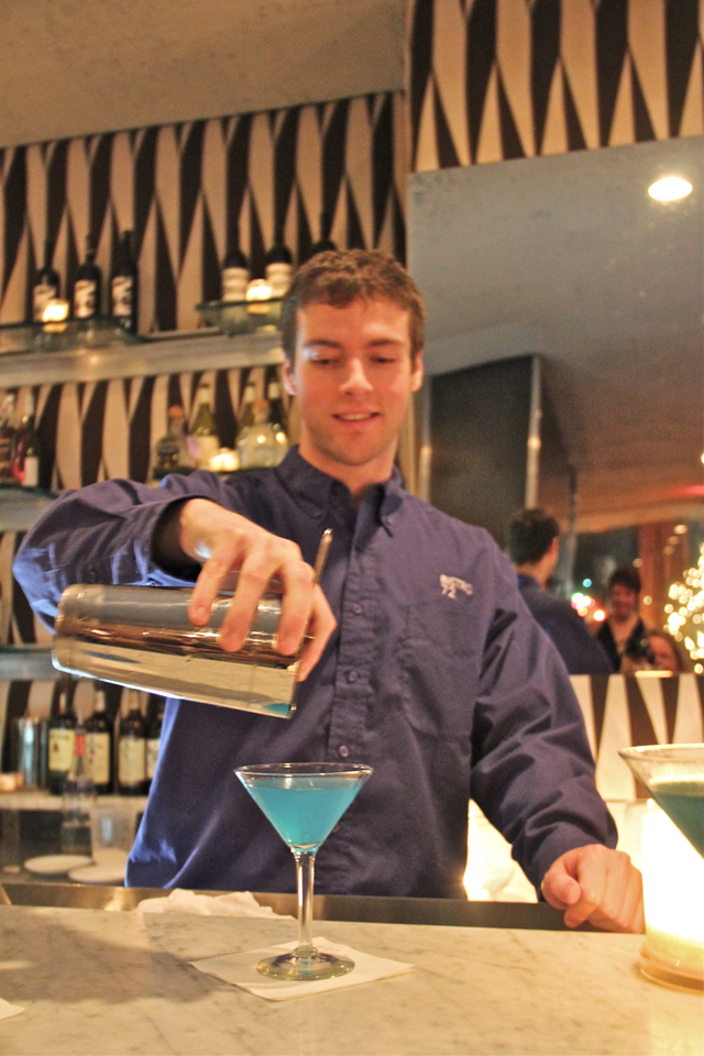 Bistro 72 at Hotel Indigo bartender Zach Leffert pouring the "Bottoms Up" cocktail. (Carrie Miller Photo)