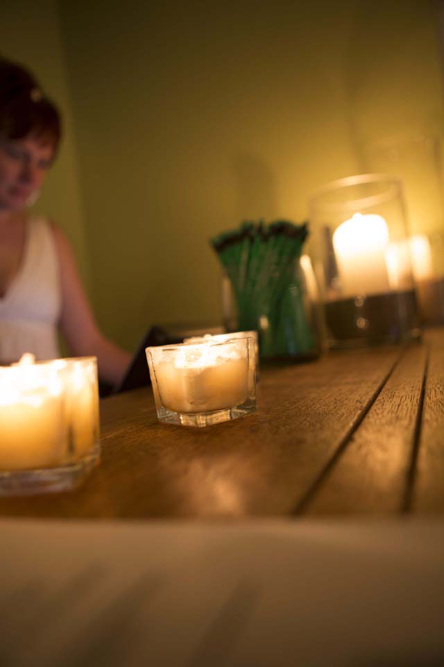 General Manager Shane Mott at the candlelit front desk.