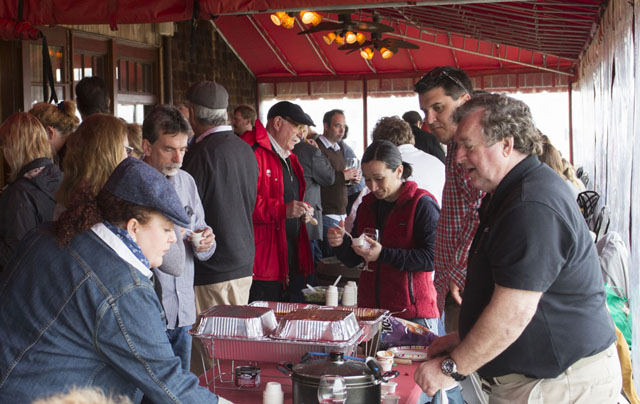 Carl Czajkowski, right, of South Jamesport chats with tasters.