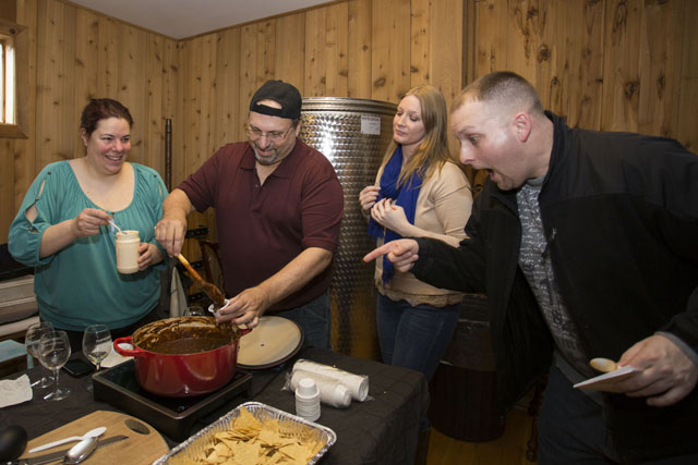 John Iaria of North Babylon, right, hams it up for the camera as wife Kim stands by. Chili cooks Marie and Pete Spaccarotella, left, of Patchogue enjoy the fun.