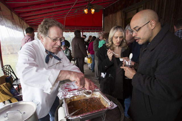 Christopher Augusta, left, of The Harvest Inn in Peconic, serves Beef bourguignon chili to Tracey and Angel Gonzalez of Manhattan.