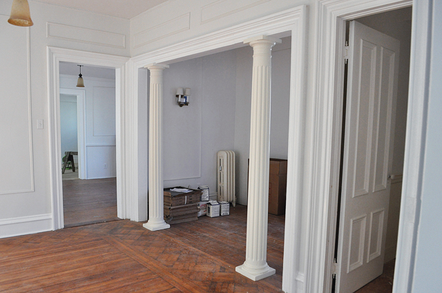 These first-floor wood columns are original to the building. (Credit: Rachel Young)