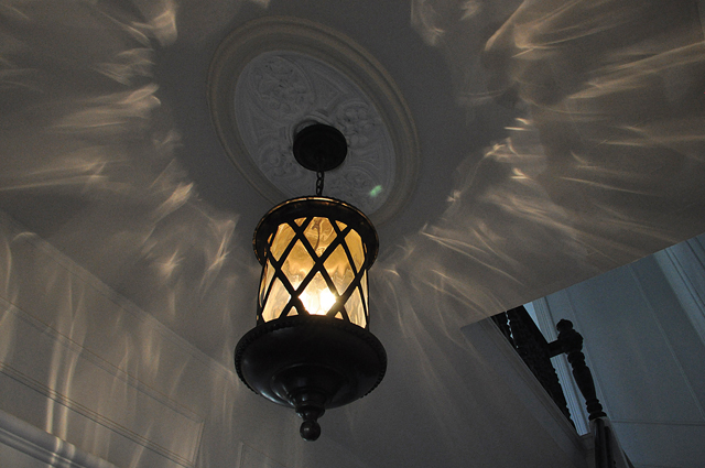 An original light fixture in the foyer. (Credit: Rachel Young)