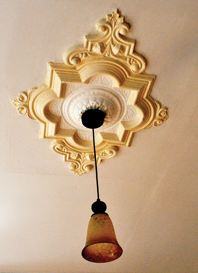 Appliqué ceiling moldings can be found throughout the house. (Credit: Rachel Young)