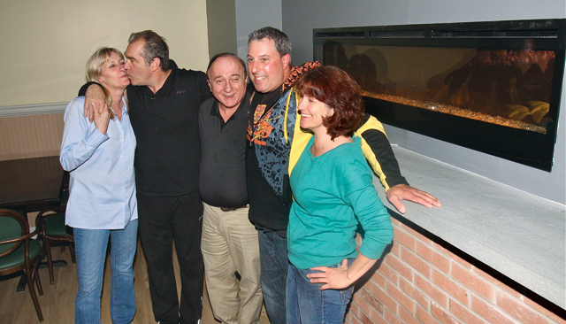 CJ’s American Grill owners, from left: Joanne Richards, Chris Richards and Sal Malguarnera, with Bobby Bugdin, restaurant principal, and manager Sandra Bilotti. (Credit: Barbaraellen Koch)