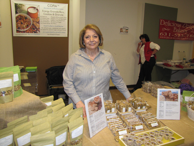 Grace Marie Longinetti of Copia Granola and Granola Bars at farmers market Saturday. She's following the market outdoors next week. (Credit: Tim Gannon)