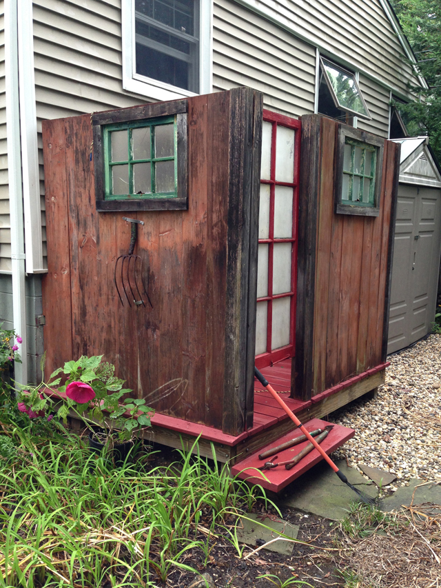 The frosted windows in Frank Covino's outdoor shower in Peconic are made from frames salvaged from a century-old colonial house and add both character and privacy. 