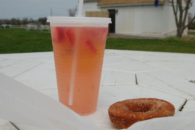 Fresh strawberry lemonade and a homemade apple cider doughnut from Harbes Family Farm in Mattituck. (Credit: Vera Chinese)