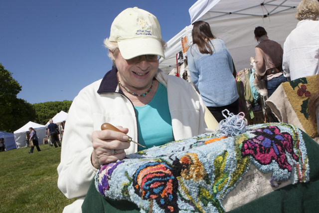 Denise Johnson of Baiting Hollow works on a needlepoint project. (Credit: Katharine Schroeder)