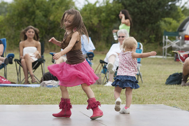 Five-year-old Kadence Pelletier and sister Lila, 1, of West Islip enjoy the music.