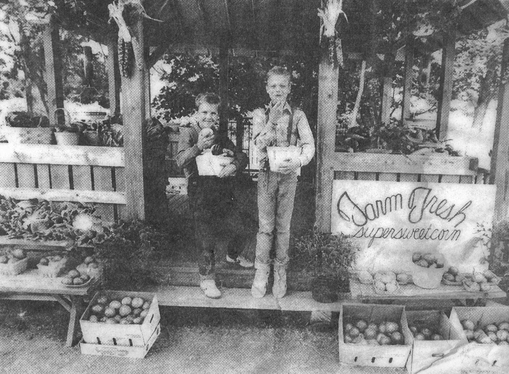 A 10-year-old Jason Harbes (right) with friend Daniel Stasiukiewicz pictured in a September 1989 Suffolk Times article about the opening of the family's farmstand. (Credit: Judy Ahrens) 