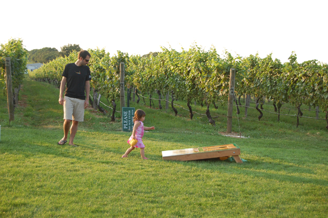 Dad and daughter enjoy a game of corn hole. (Credit: Vera Chinese)