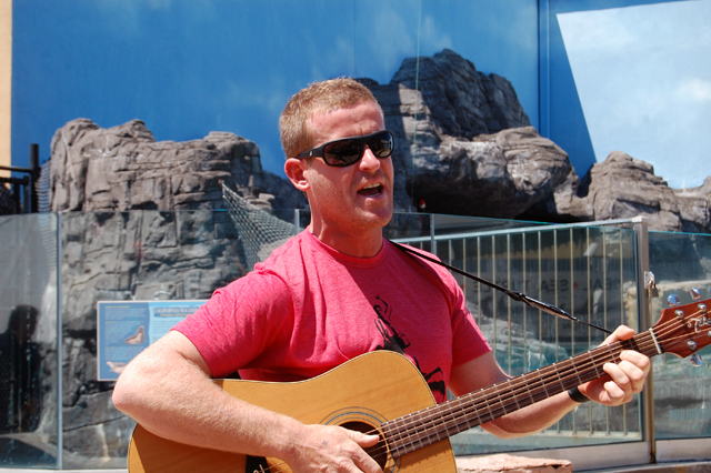 Andy Casagrande sings a song about sharks at the Long Island Aquarium and Exhibition Center on Saturday. (Credit: Vera Chinese)