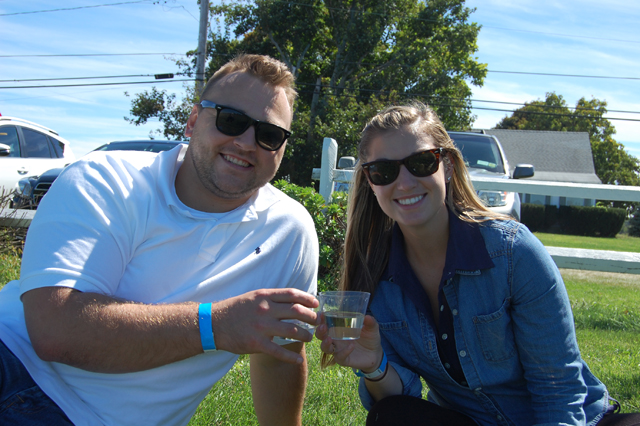 Jacob Natrigo of Rochester and emily McIntyre of South Jamesport enjoy a bottle of Harbes Sauvignon Blanc. 