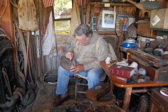 Jack Combs of Southold assess the value of this old decoy.
