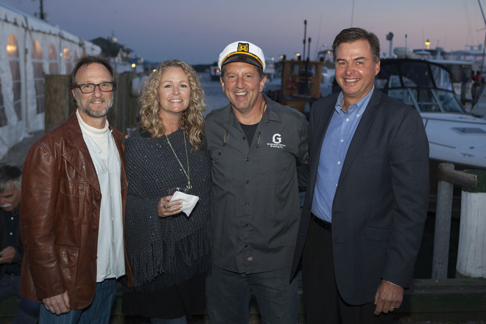 From left:  Greenport Mayor David Nyce, Greenport Harbor Brewery's owners Ann and Rich Vandenburgh and Suffolk County  legislator Al Krupski. (Credit: Katharine Schroeder)