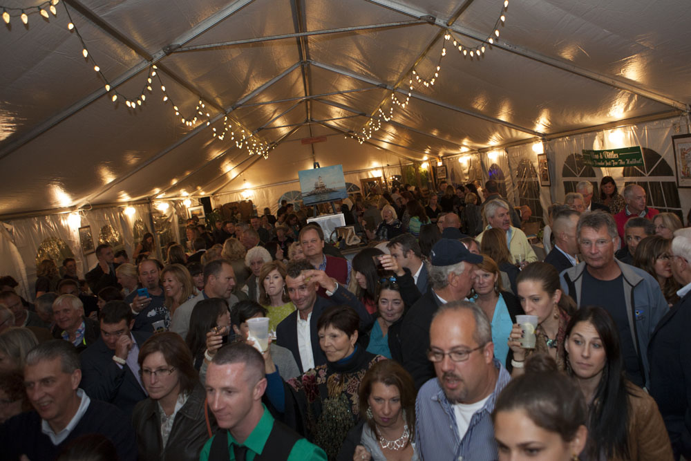 The crowd toasts Otto Schoenstein. (Credit: Katharine Schroeder)