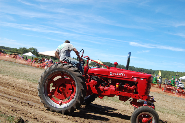 Jason Pisaneschi of East Quogue, a member of the Long Island Antique Power Association, competes in the tractor pull competiton.