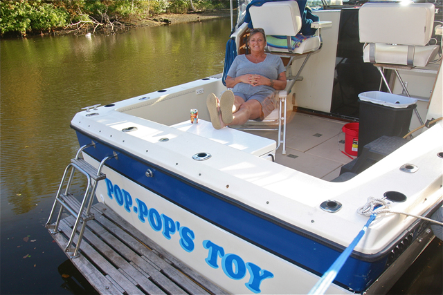 Maggie Bender of Calverton on her brother Charlie Bender's boat waiting for family and friend's to come and