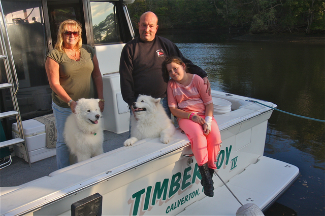 Diane and Wayne Dedicke of Calverton with their niece Sydney Palmer and dogs Molly and Breeze.