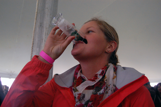 Megan Connolly of Riverhead dons a fake moustache and enjoys a taste of hard cider.