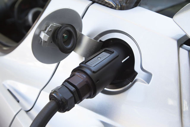 A Tesla car plugged in.