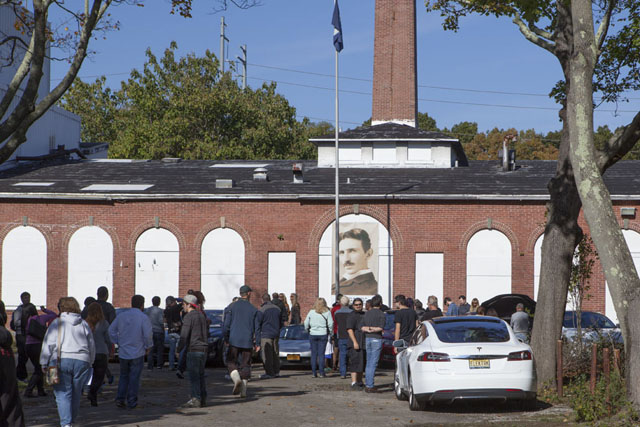 Cars and people outside the lab.