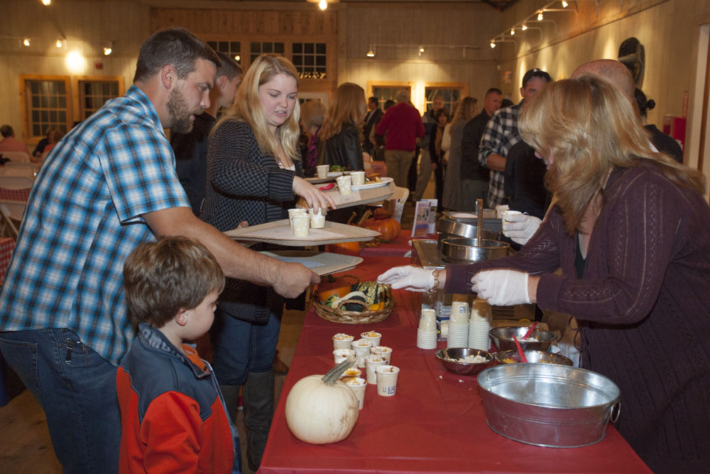 The Fife family of Aquebogue samples Jamesport Manor Inn's pork and bean chili. (Credit: Katharine Schroeder)