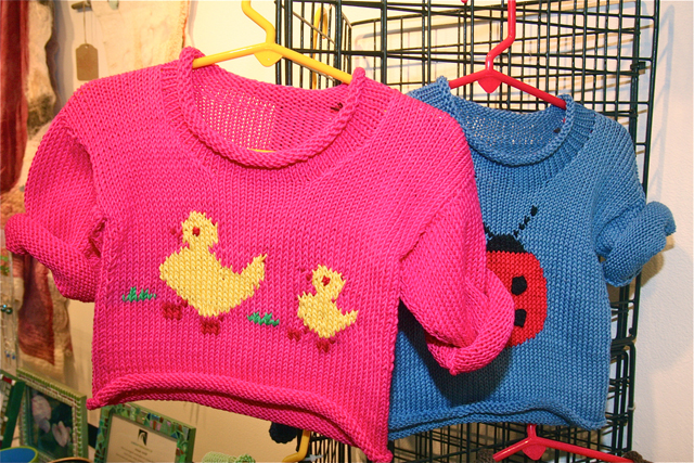 Yu Lu-Bovier of Remsenburg knits cotton yarn children's sweaters and hats.
