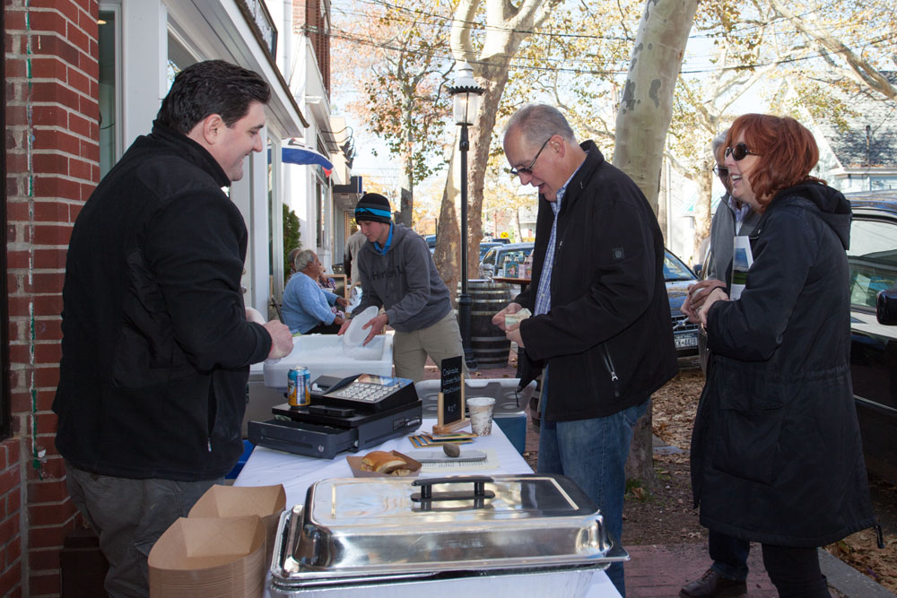 Greg Ammirati, owner of Ammirati Love Lane serves David and Joanne Kalt of Centerville, Va.