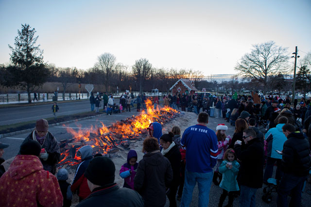 Gathering around the bonfire.