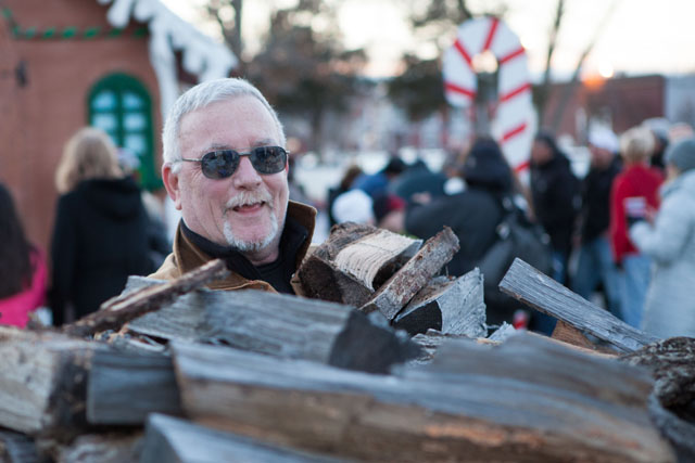 Gary Joyce gathers another load of wood for the fire.