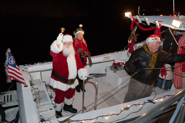 Santa waves from the boat.
