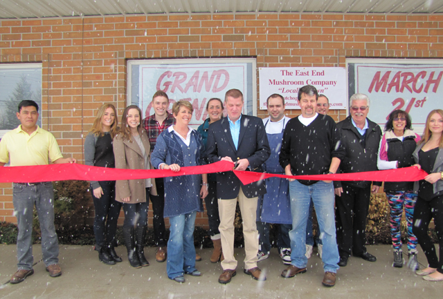 Southold Town Supervisor Scott Russell cuts the ribbon Saturday morning. (Credit: Tim Gannon)