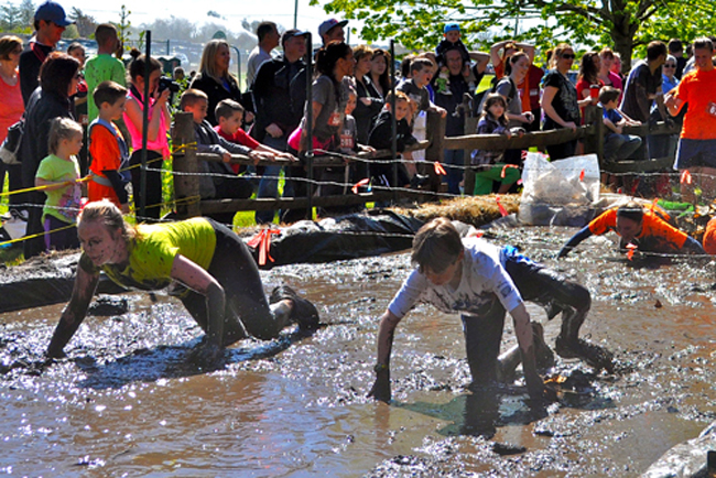 Survival Race participants get muddy during the 2013 race at the 4-H camp in Riverhead (Credit: Rachel Young file photo).
