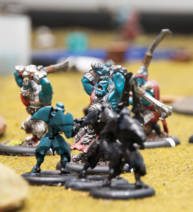 One of Thomas Bermudez's troll figures charges into battle against an armored elven foe. This unite would soon be eliminated by a band of nearby enemy archers, knocking the troll out of the fight. (Credit: Paul Squire)