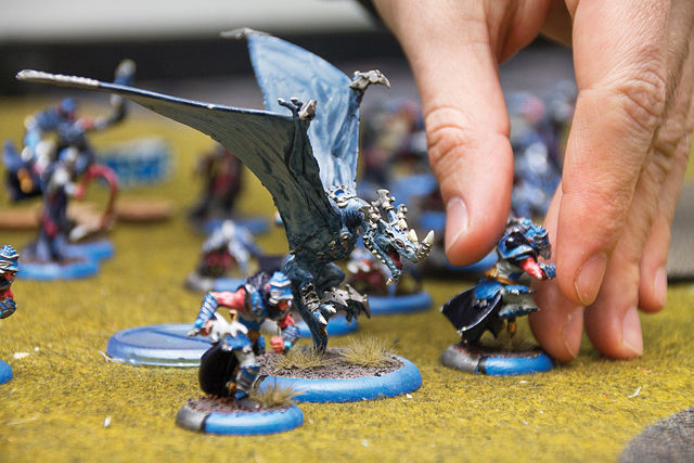 In this war game, opponents send armies of units — like these samurai-style warriors — into battle. A single match in Warmachine can take more than an hour to finish. (Credit: Paul Squire)